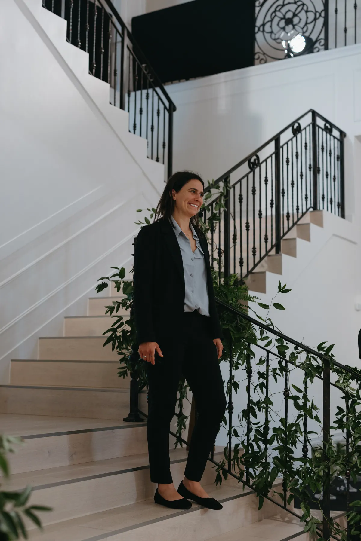 Editorial founder portrait of Dr. Ariana Fontenot on a staircase between events.